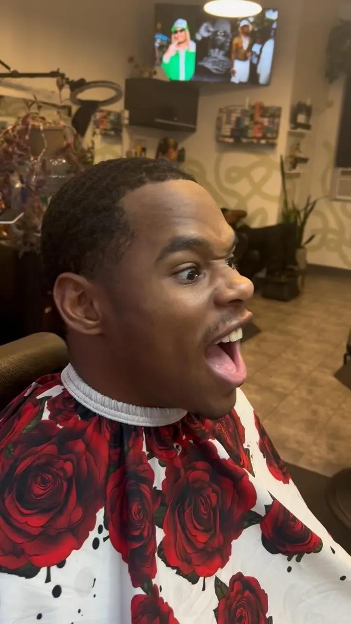 Client reacting to a fresh cut in the chair