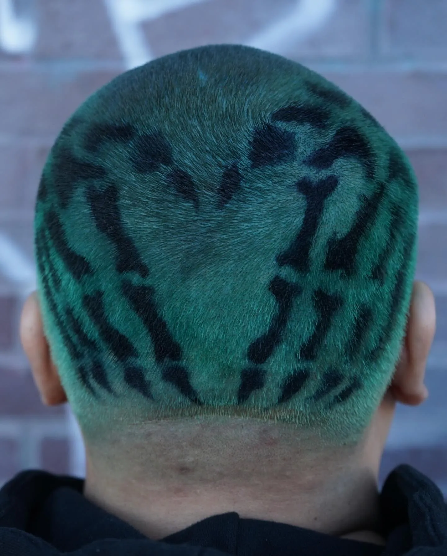 Green hair color with black pattern design, back of head